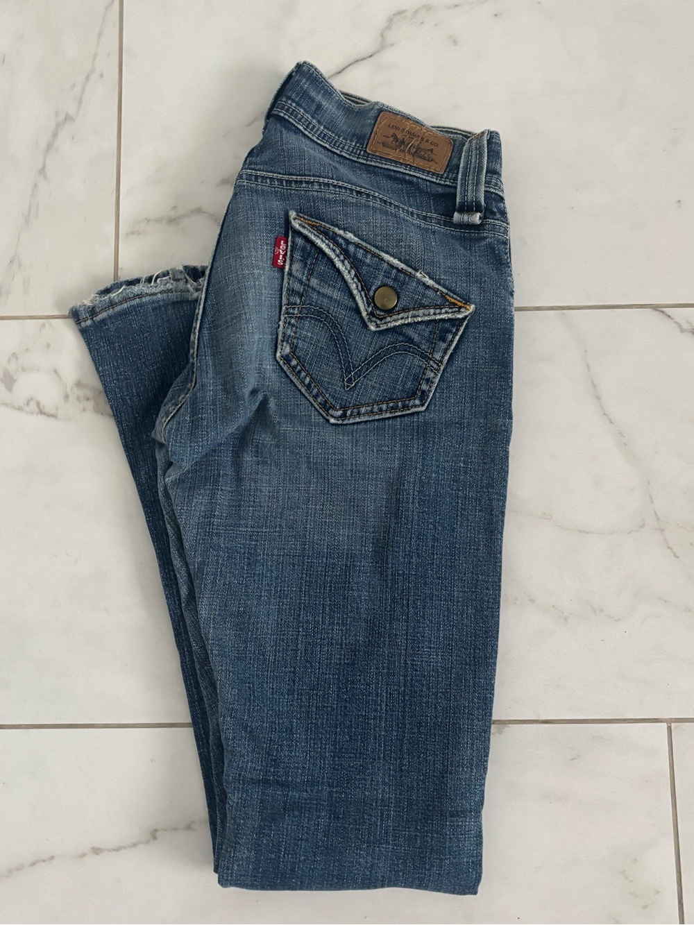Levi's Women's Distressed Dark Blue low rise boot cut Jeans